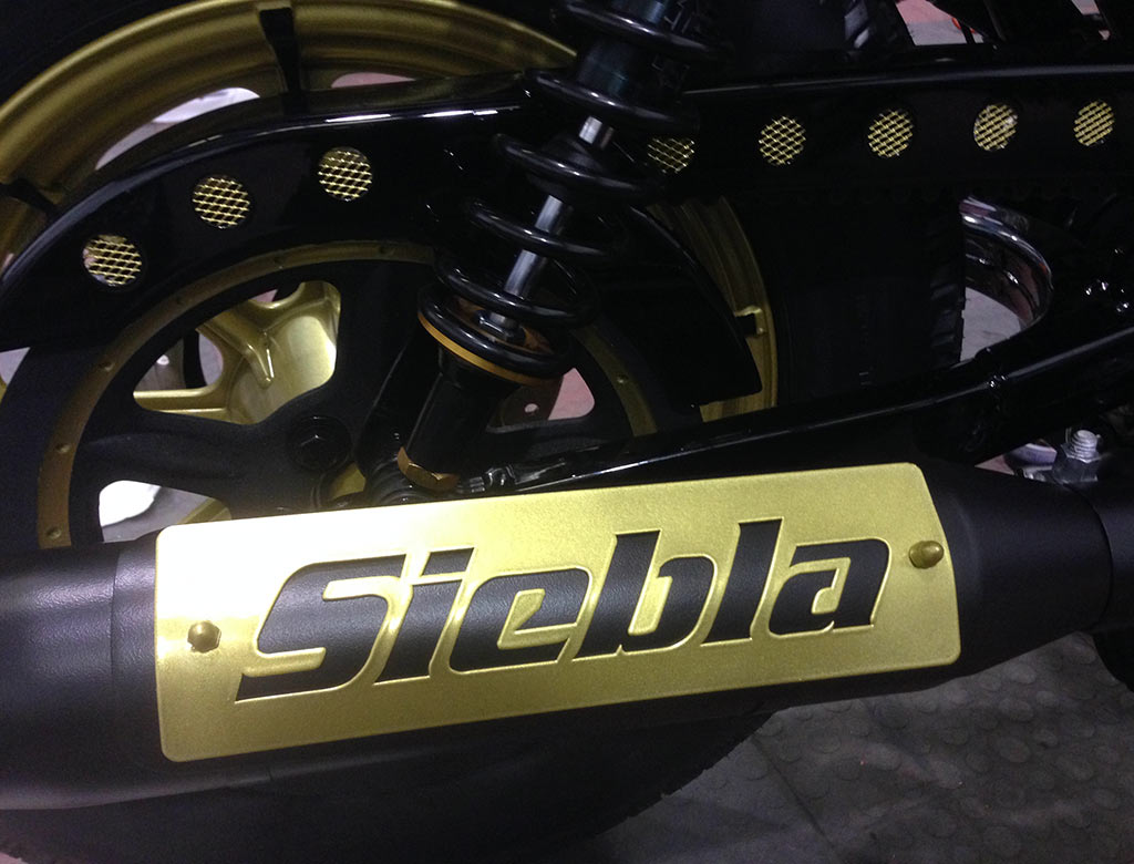Plate detail on the exhaust of the Siebla Racer